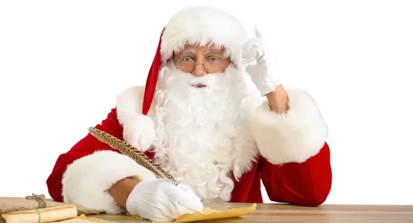 Weihnachtsmann Schreibt Brief Tisch Auf Weißem Hintergrund — Stockfoto