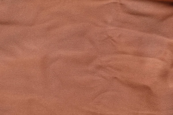 Widok Bliska Brązowej Tkaniny Jako Tła — Zdjęcie stockowe