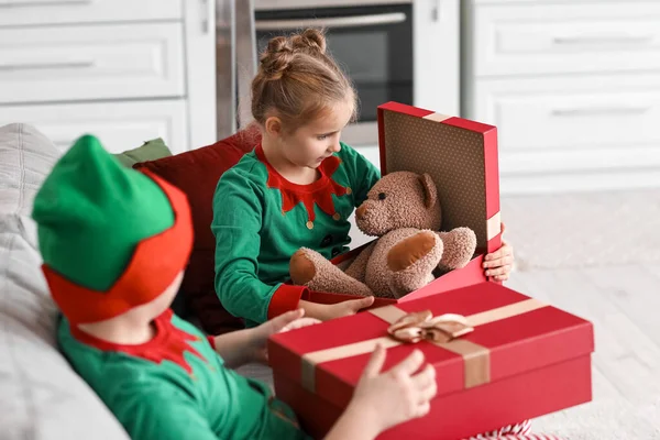 Little Girl Dressed Elf Opening Christmas Gift Kitchen — Stock Photo, Image