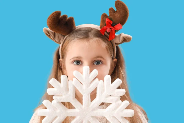 Little Girl Reindeer Horns Snowflake Blue Background Closeup — Stock Photo, Image