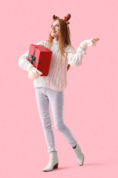 Young Woman Reindeer Horns Christmas Present Pink Background — Stock Photo, Image
