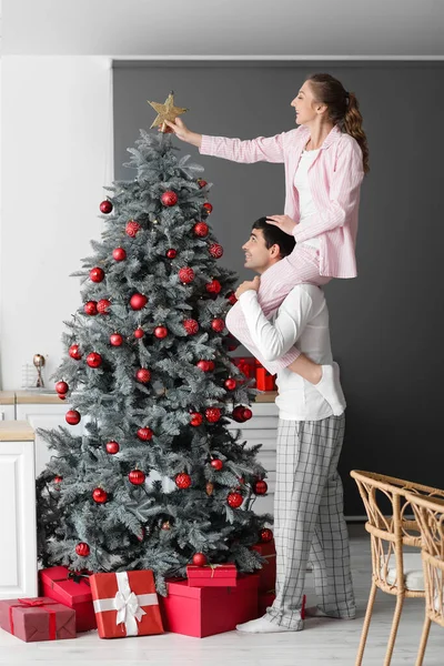 Loving Couple Decorating Christmas Tree Kitchen — Stock Photo, Image
