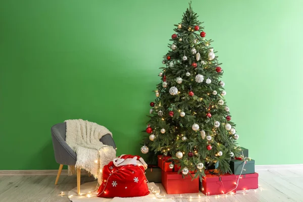 Santa Bag Armchair Glowing Lights Christmas Tree Green Wall — Stock Photo, Image