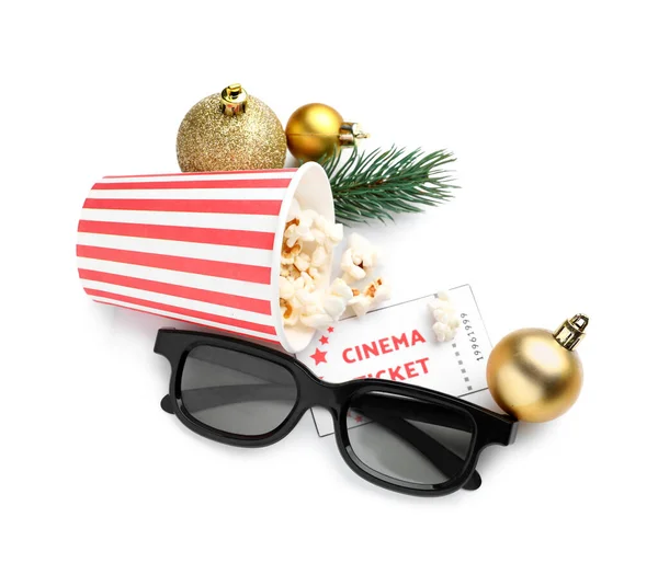 Bucket of popcorn, cinema ticket, 3D glasses, fir branch and Christmas balls on white background