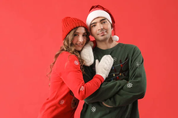 Loving Couple Christmas Sweaters Red Background — Stock Photo, Image