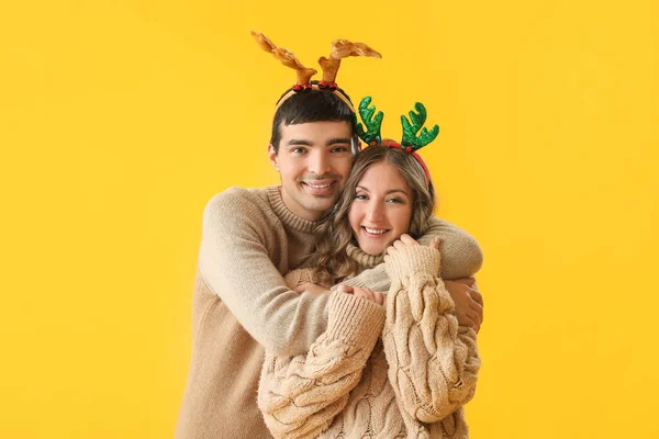 Loving Couple Reindeer Horns Hugging Yellow Background — Stock Photo, Image