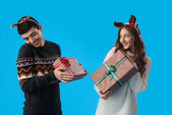 Loving Couple Reindeer Horns Christmas Presents Blue Background — Stock Photo, Image