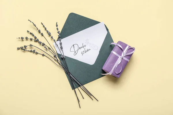 Card Text Danke Schon Envelope Gift Box Lavender Flowers Beige — Stock Photo, Image