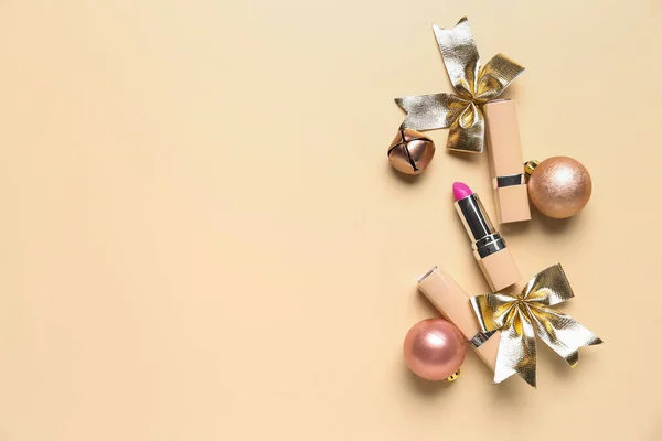 Lipsticks Christmas Balls Bell Bows Beige Background — Stock Photo, Image