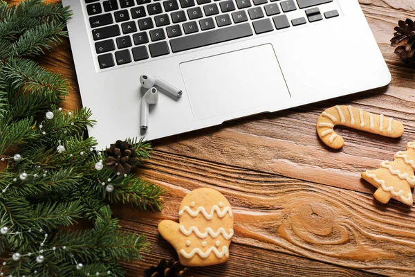 Composition Fir Branches Christmas Cookies Earphones Laptop Wooden Background Closeup — Stock Photo, Image