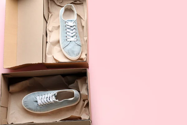 Cardboard Box Blue Sneakers Pink Background — Stock Photo, Image