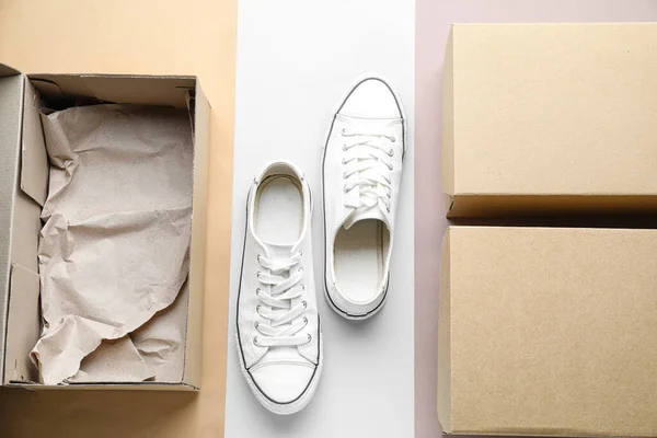 Cardboard Boxes White Sneakers Light Background — Stock Photo, Image