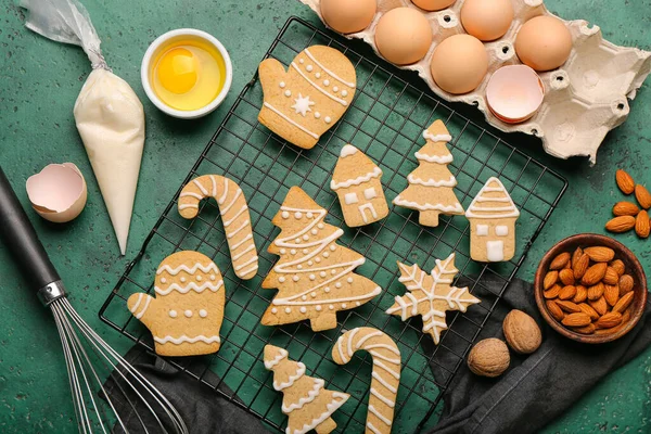Composition with tasty Christmas cookies and ingredients on color background