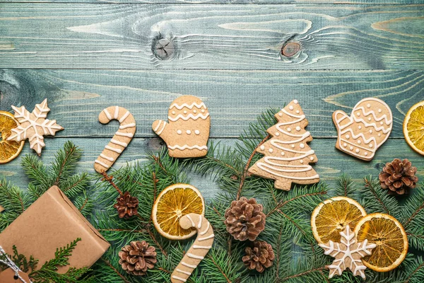 Composition Tasty Christmas Cookies Fir Branches Cones Color Wooden Background — Stock Photo, Image