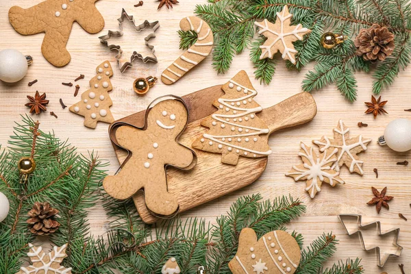 Composition Tasty Christmas Cookies Cutters Fir Branches Wooden Background — Stock Photo, Image