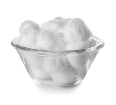 Bowl of soft cotton balls on white background clipart