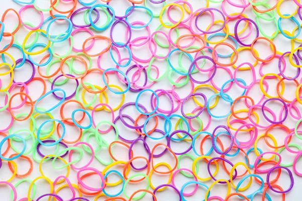 Texture of colorful rubber bands on white background