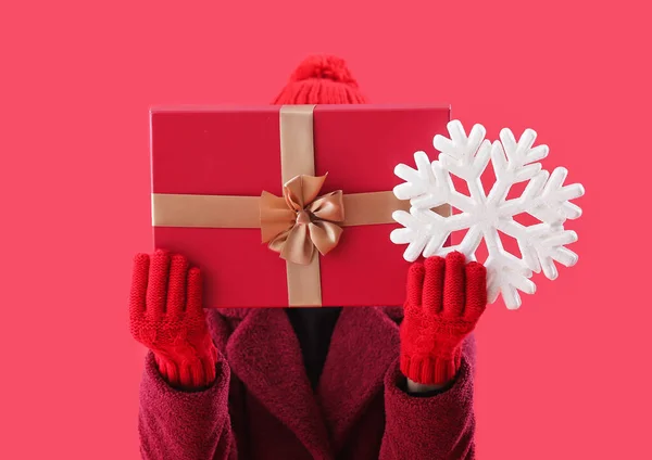 Woman Christmas Present Snowflake Red Background Closeup — Stock Photo, Image