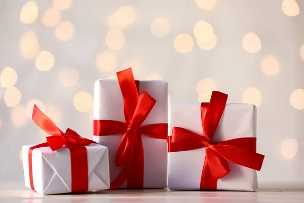Christmas Gifts Table Blurred Lights — Stock Photo, Image