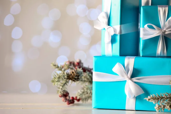 Beautiful Christmas Gifts Table Blurred Lights Closeup — Stock Photo, Image