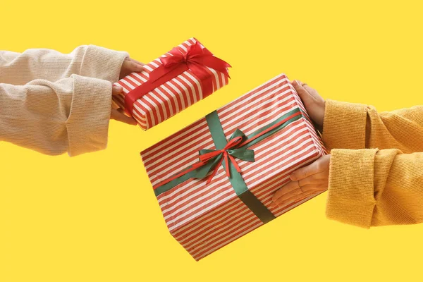 Women Christmas Gift Boxes Yellow Background — Stock Photo, Image