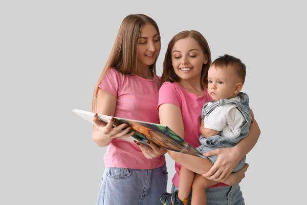 Happy Lesbian Couple Little Baby Book Grey Background — Stock Fotó