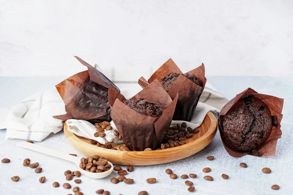 Wooden Plate Tasty Chocolate Muffins Coffee Beans Light Background — Stock Photo, Image
