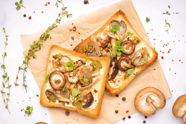 stock image Tasty toasts with cream cheese, mushrooms and spices on light background