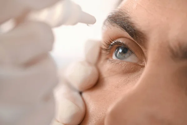 Ophthalmologist Putting Drops Young Man Eye Hospital Closeup — Stock Photo, Image