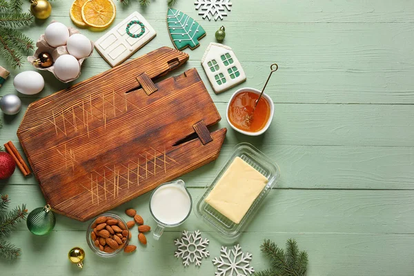 Composition Cutting Board Christmas Cookies Ingredients Decorations Color Wooden Background — Stock Photo, Image
