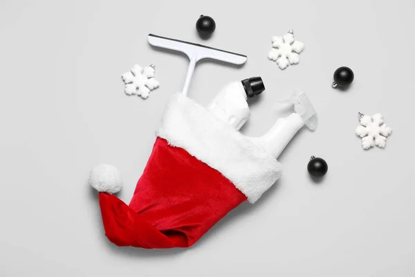 Santa Hat Cleaning Supplies Christmas Decor Grey Background — Stock Photo, Image