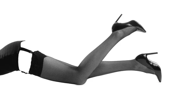 黒のストッキングと白に隔離されたハイヒールの靴で美しい女性の足 — ストック写真