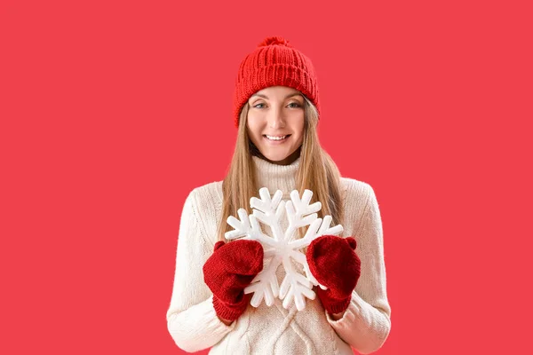 Young Woman Warm Hat Big Snowflake Red Background — Stock Photo, Image
