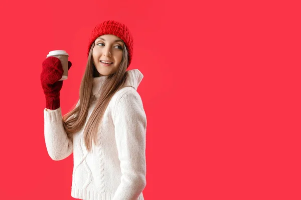 Young Woman Warm Hat Takeaway Cup Coffee Red Background — Stock Photo, Image