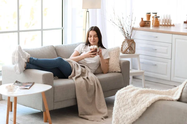 Young Woman Glass Cup Cocoa Lying Grey Sofa Kitchen — Stock Photo, Image
