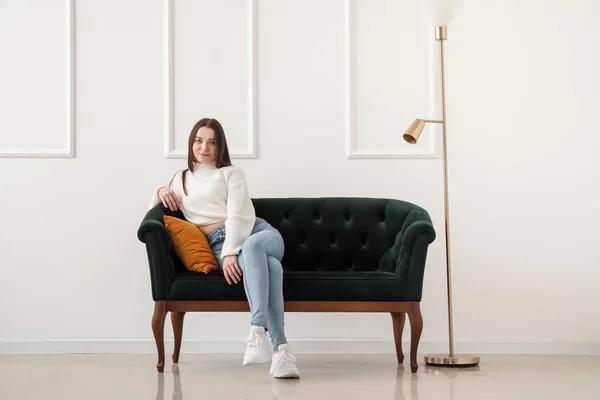 Young Woman Sitting Green Sofa Light Wall — Stock Photo, Image