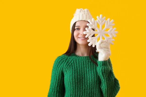 Young Woman Warm Hat Big Snowflake Yellow Background — Stock Photo, Image
