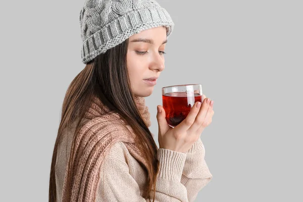 Young Woman Warm Hat Glass Cup Tea Grey Background Closeup — Stock Photo, Image