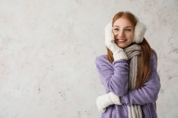 Young Redhead Woman Warm Earmuffs Scarf Light Background — Stock Photo, Image