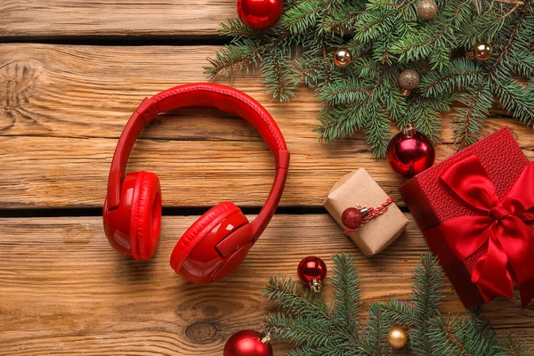 Composition Modern Headphones Christmas Gifts Balls Fir Branches Wooden Background — Stock Photo, Image