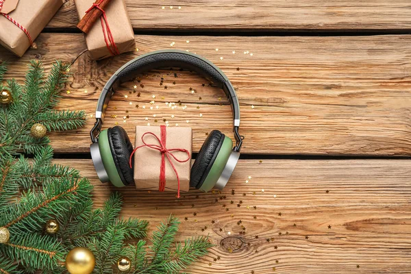 Composition Modern Headphones Christmas Gifts Fir Branches Wooden Background — Stock Photo, Image