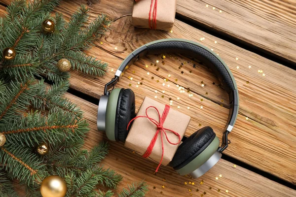Composition Modern Headphones Christmas Gifts Fir Branches Wooden Background — Stock Photo, Image