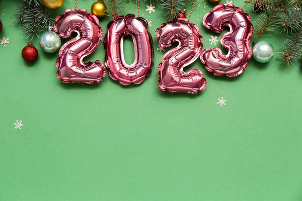 Figure 2023 Made Foil Balloons Christmas Branches Balls Green Background — Stock Photo, Image