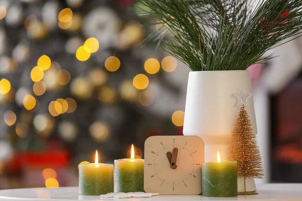 Clock Burning Candles Vase Fir Branches Table Blurred Christmas Tree — Stock Photo, Image