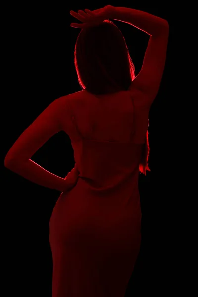 Silhouet Van Jonge Vrouw Zijdezachte Jurk Zwarte Achtergrond Achteraanzicht — Stockfoto