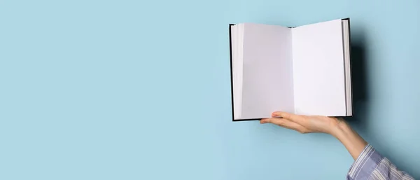 Hand Holding Blank Book Light Blue Background Space Text — Stock Photo, Image