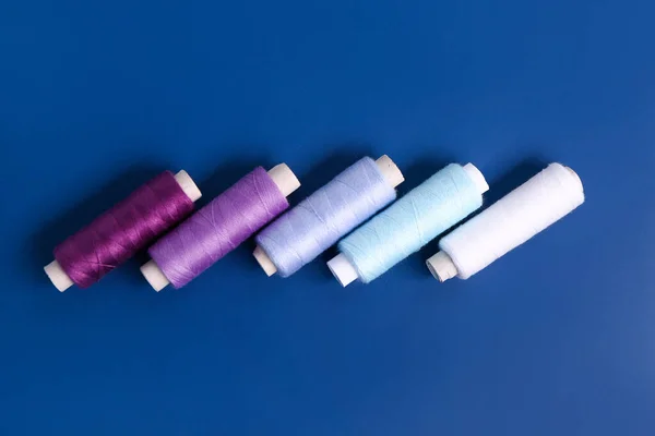 Set Thread Spools Blue Background — Stock Photo, Image