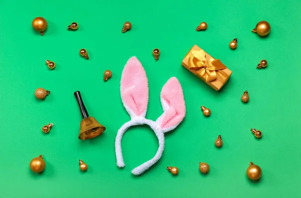 Bunny Ears Christmas Bell Balls Gift Green Background — Stock Photo, Image