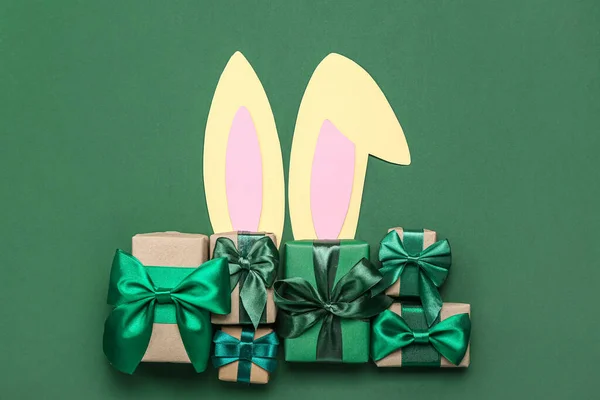 Paper Bunny Ears Christmas Gifts Green Background — Stock Photo, Image