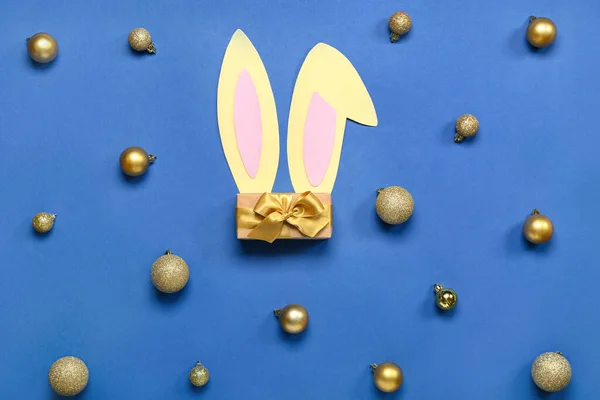 Bunny Ears Christmas Balls Gift Blue Background — Stock Photo, Image
